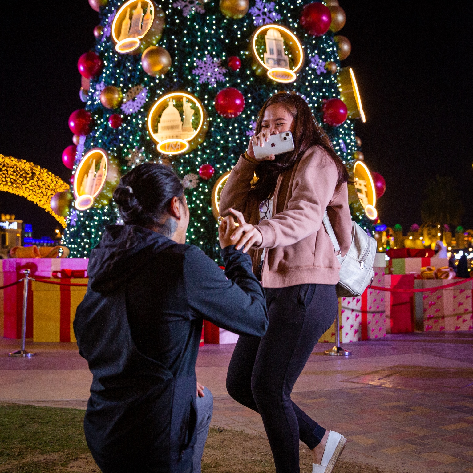 Couple get engaged under the giant festive tree at Global Village